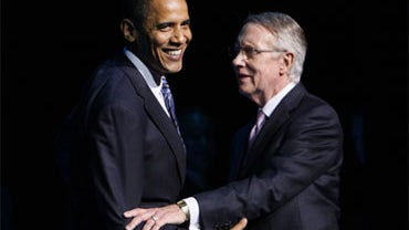 In this file photo taken May 26, 2009, President Barack Obama stands with Senate Majority Leader Harry Reid, D-Nev., at a fundraising event in Las Vegas. 