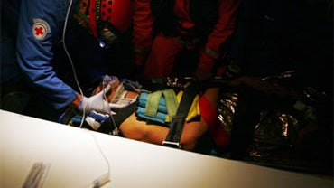 Rescue workers treat inside an ambulance Nadine Cardoso, the co-owner of the Hotel Montana after been rescued from the wreckage of the building in Port-au-Prince, Sunday, Jan. 17, 2010. 