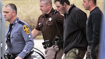 Murder suspect Christopher Speight led out of State Police headquarters in Appomattox, Va., Wednesday, Jan. 20, 2010. 