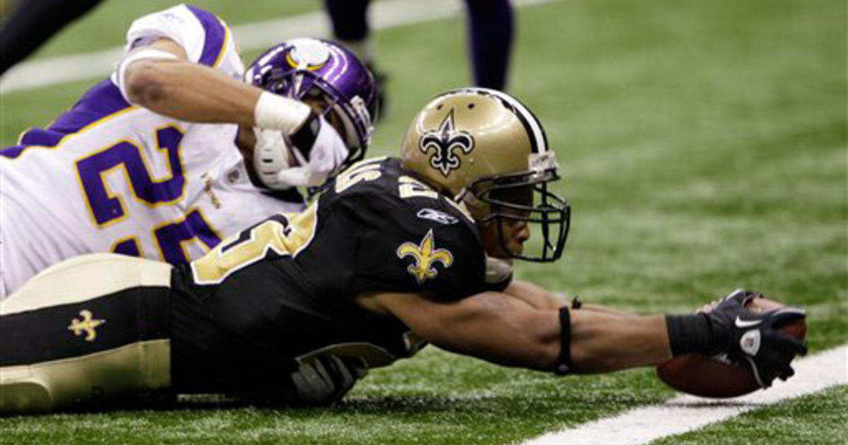 Minnesota Vikings Darren Sharper reacts as he runs back an