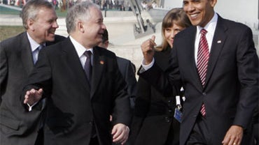 US President Barack Obama, second right, shares a word with Poland's President Lech Kaczynski, center, and NATO Secretary General Jaap de Hoop Scheffer under the Passerelle bridge during an event at the NATO summit in Kehl, Germany on Saturday April 4, 20 