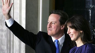 Britain's new Prime Minister David Cameron and his wife Samantha wave to the media outside 10 Downing Street in London,Tuesday, May, 11 2010. (AP Photo/Tim Hales) 