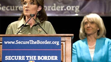 Former Alaska Governor Sarah Palin, left, speaks as Arizona Gov. Jan Brewer looks on at a news conference about border security at the JW Marriott Desert Ridge in Phoenix on Saturday, May 15, 2010. Brewer and Palin blamed President Barack Obama for the st 