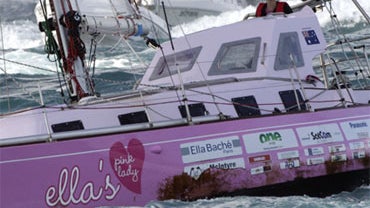 Sixteen-year-old Jessica Watson sails past the finish line at the entrance to Sydney Harbour in Sydney, Australia, Saturday, May 15, 2010, capping off a nearly 23,000 nautical miles voyage. 