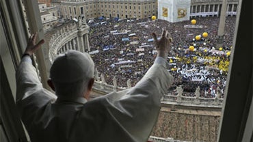 Pope Benedict XVI blesses faithful from the window of his studio overlooking St. Peter's Square at the Vatican, Sunday, May 16, 2010.  