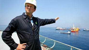 In this May 28, 2010 photo, BP CEO Tony Hayward stands aboard the Discover Enterprise drill ship during recovery operations in the Gulf of Mexico, south of Venice, La. (AP Photo/Sean Gardner, Pool) 