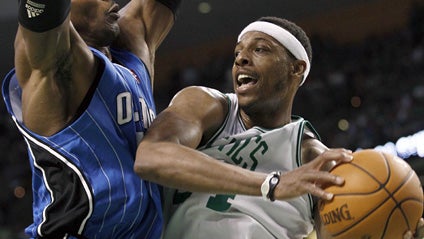 Boston Celtics forward Paul Pierce, right, drives against Orlando Magic center Dwight Howard, left, during the third quarter in Game 6 of the NBA Eastern Conference basketball finals in Boston, Friday, May 28, 2010. 