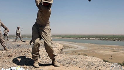 carousel: U.S. troops teeing off at a base in Afghanistan.  