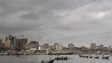 Unable to work in the open sea due to a blockade imposed by the Israeli Navy, which limits ships to within two kilometers from the coast, Palestinian fishermen fish inside the port of Gaza City, Saturday, June 5, 2010. Israeli warships were tailing a Gaza 