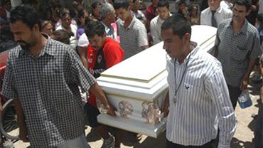 Friends and relatives of Sergio Adrian Hernandez Huereka, 15, carry his coffin before his burial in the northern border city of Ciudad Juarez, Mexico, Thursday June 10, 2010. A U.S. Border Patrol agent fatally shot Hernandez Monday after a group trying to 
