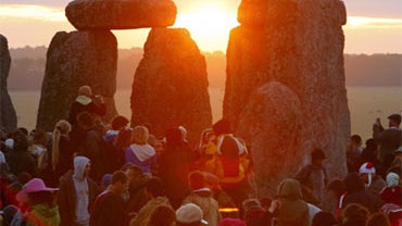 Revellers gather at the World Heritage site at Stonehenge in Wiltshire to watch the sunrise during the summer solstice, marking the longest day of the year.  