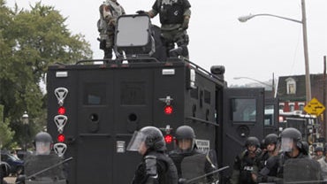 In this Thursday Sept. 24, 2009, photo, a Long-Range Acoustic Device is seen mounted atop a law enforcement vehicle on the streets of Pittsburgh during the G-20 Summit.  