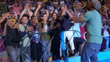 Chen Lo and the Liberation Family in performance in Amar, Jordan, as part of the U.S. State Department's Rhythm Road program. The Brooklyn music group traveled to Morocco, Tunisia, Algeria, Lebanon, Jordan, and Syria. 