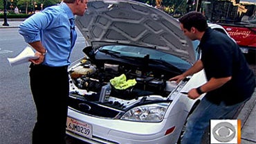 AutoMD.com expert mechanic  Bobby Baldassari, right, showing "Early Show" co-anchor Chris Wragge the fixes that are easy to do yourself, and those to not even consider trying on your own, on July 5, 2010 