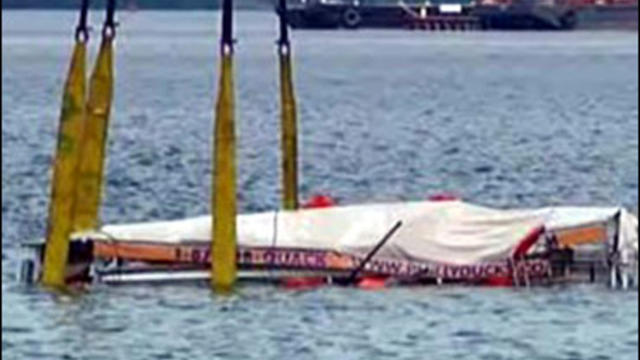 The sunken duck boat is retrieved from the bottom of the Delaware River, Philadelphia, July 9, 2010. 