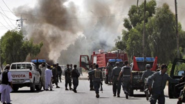 Smoke rises from the scene of an explosion in Kandahar, south of Kabul, Afghanistan on Saturday, July 10, 2010.  