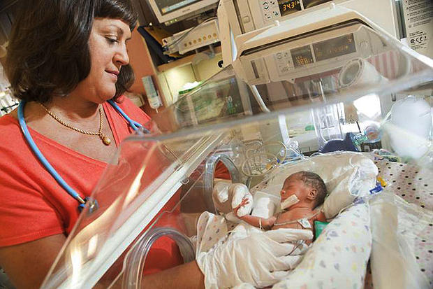 Dr. Susan Dulkerian tends to a baby in the NICU of Mercy Hospital. Part of a new series on Discovery Health. 
