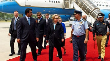 U.S. Secretary of State Hillary Rodham Clinton walks on the red carpet upon her arrival at PAF Base Chakala in Islamabad for meetings with leaders and officials Sunday, July 18, 2010.  
