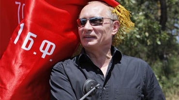 Russian Prime Minister Vladimir Putin attends a meeting of motorbikers at their camp at Gasfort Lake, near Sevastopol in Ukraine's Crimea Peninsula, Saturday, July 24, 2010. 
