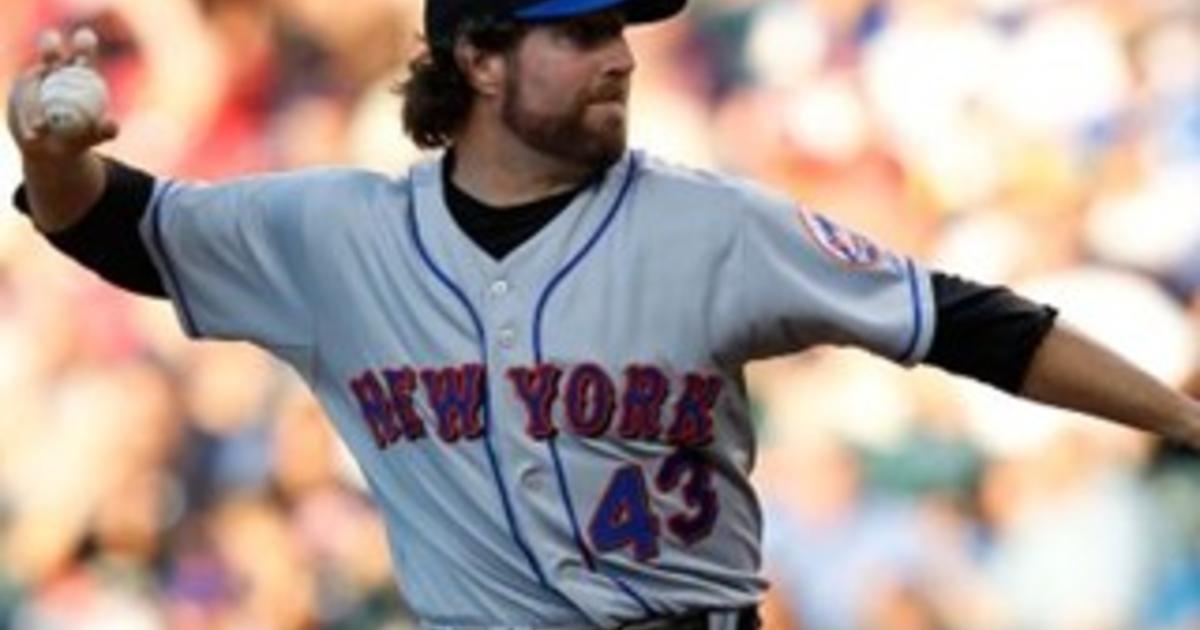 New York Mets manager Jerry Manuel, left, comes out to take starting  pitcher R.A. Dickey, right, out of the game as catcher Josh Thole, center  left, and third baseman David Wright, center