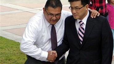 Bell's interim chief administrative officer Pedro Carrillo, left, welcomes California State Controller John Chiang, who will conduct an independent audit of the city's finances to improve Bell's accountability to the public, Tuesday, July 27, 2010, in Bel 