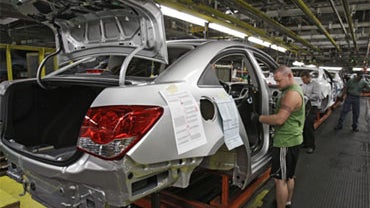 Matthew Mines assembles a test model of the new Chevrolet Cruze at General Motors' Lordstown Assembly Plant in Lordstown, Ohio. 