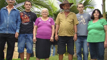 Dimas Jose Aliprandi, second from left, and his parents (Antonio Paulino Aliprandi and Zilda Maestrini Aliprandi) pose for pictures with Elton Plaster, second from right, and his parents (Adelson Plaster and Nilza Braun Plaster) as they meet in Santa Mari 