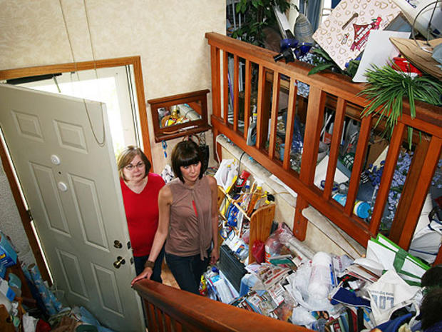 Cindy Carroll and daughter Lori enter Cindy's house full or hoarding horrors.  