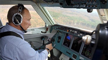 Russian Prime Minister Vladimir Putin sits in the co-pilot's seat of a jet fighting forest fires in the Ryazan region, Russia, Aug. 10, 2010. 