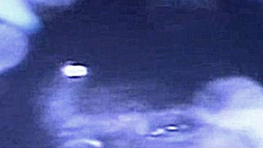 In this frame grab taken from a computer screen shows a recorded image of Florencio Avalos, one of 33 trapped miners, during the first contact with a video camera in Copiapo, Chile, Sunday, Aug. 22, 2010. 