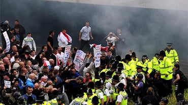 English Defense League supporters clash with police in Bradford Saturday, Aug. 28, 2010 during a demonstration in the city. 