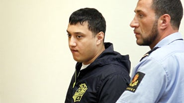 David Jakobsen, one of three people accused of plotting acts of terrorism in Norway, as he is lead out of Oslo municipal court, July 26, 2010. 