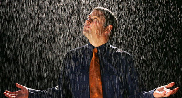 man standing in rain 