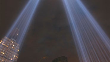 The Tribute in Lights are tested from a rooftop near ground zero on Friday, Sept. 10, 2010 in New York. 