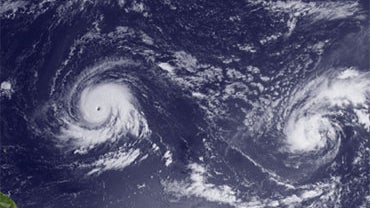 This Monday Sept. 13, 2010 satellite image provided by NOAA shows on the left Hurricane Igor, east of the Northern Leeward Islands, and Tropical Storm Julia (right), south-southwest of the Cape Verde Islands. 