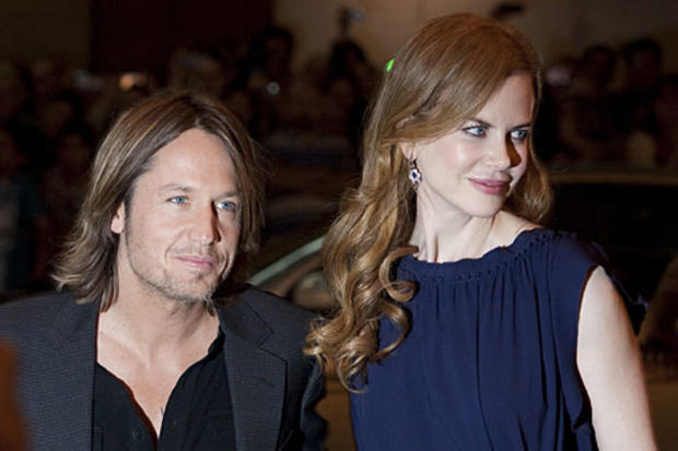 Nicole Kidman, right, and husband Keith Urban arrive on the red carpet for the screening of the film Rabbit Hole during the 2010 Toronto International Film Festival in Toronto, Monday, Sept. 13, 2010. (AP Photo/The Canadian Press, Darren Calabrese) 