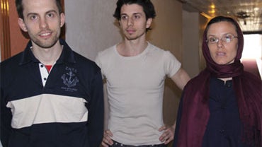 American hikers Shane Bauer, left, Josh Fattal and Sarah Shourd stand prior to meeting with their mothers at the Esteghlal hotel in Tehran, May 21, 2010.  