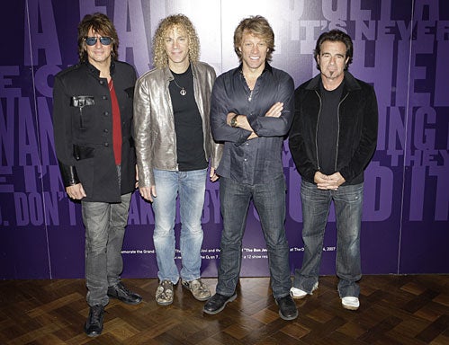 Rock band Bon Jovi, from left, guitarist Richie Sambora, keyboardist David Bryan, lead singer Jon Bon Jovi and drummer Tico Torres pose  at the start of their show in east London. (AP Photo/Joel Ryan, file) 