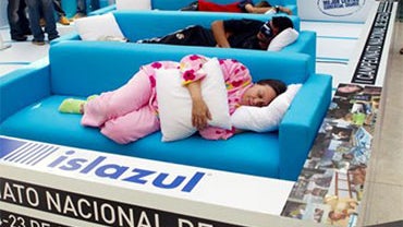 A doctor checks as people sleep a siesta during the first Siesta Championship in Madrid, Thursday, Oct. 14, 2010. The participants of the siesta contest win points for the first person to fall asleep, the loudest snorer, best original sleeping position an 
