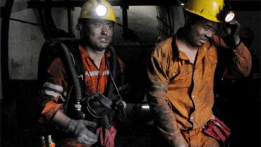 Rescuers are ready to go underground after an explosion at the state-run Pingyu Coal & Electric Co. Ltd. mine in Yuzhou city, central China's Henan province, on Saturday, Oct. 16, 2010.  