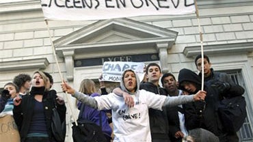 High school children block their school with a banner reading "School children on strike" in Marseille, southern France, Monday Oct. 18, 2010. French oil workers on Monday defied the government's demand to get back to work and end scattered fuel shortages 