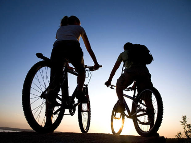 bike riding couple at night 