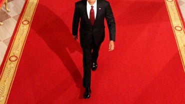 President Barack Obama walks into a news conference, the day after Republicans gained 60 seats in the House of Representatives during the midterm elections, in the East Room of the White House November 3, 2010 in Washington, DC. As of the morning of Novmb 