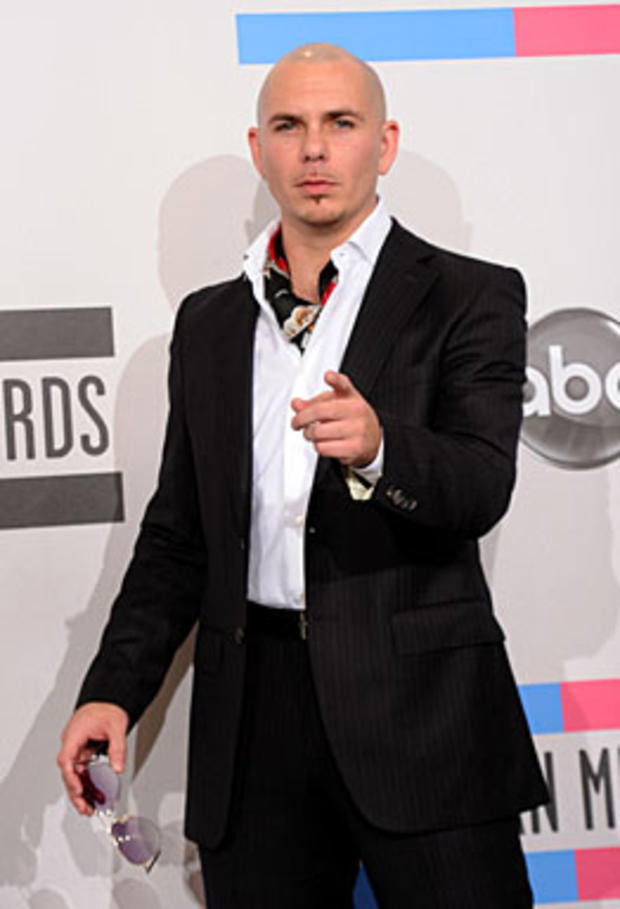 : Singer Pitbull poses in the press room during the 2010 American Music Awards held at Nokia Theatre L.A. Live on November 21, 2010 in Los Angeles, California. (Photo by Jason Merritt/Getty Images for DCP) 