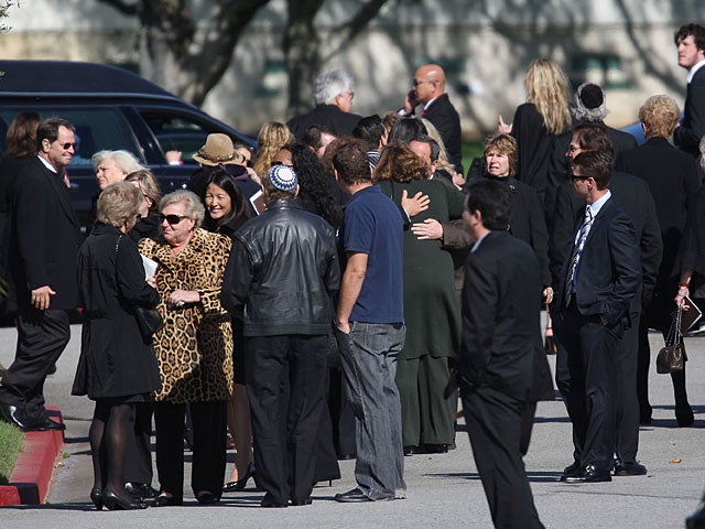 Guests arrive to the funeral service for movie publicist Ronni Chasen at Hillside Memorial Park and Mortuary on November 21, 2010 in Culver City, California. Chasen was shot to death in Beverly Hills as she drove home from the after-party premiere for the 