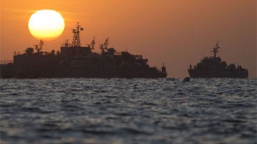 South Korean ships stage off of the coast of South Korea's Yeonpyeong Island Sunday, Nov. 28, 2010.  