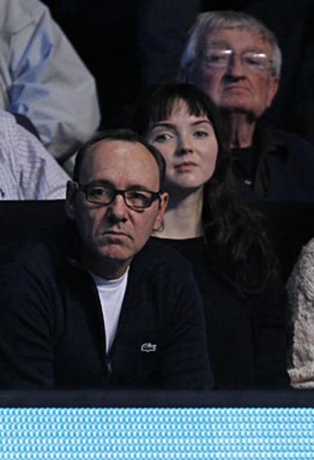 :  US actor Kevin Spacey (L) and model Lily Cole watch the singles final between Switzerland's Roger Federer (not pictured) and Spain's Rafael Nadal (not pictured), on the last day of the ATP World Tour Finals, at the O2, in south-east London on November  