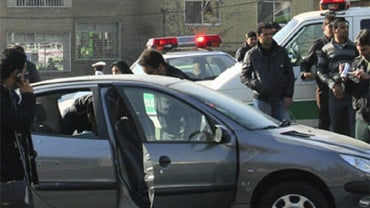 This photo released by Fars News Agency is claimed by them to show one of the damaged cars following bomb attacks on the vehicles of two nuclear scientists in Tehran, Iran, Monday, Nov. 29, 2010. 