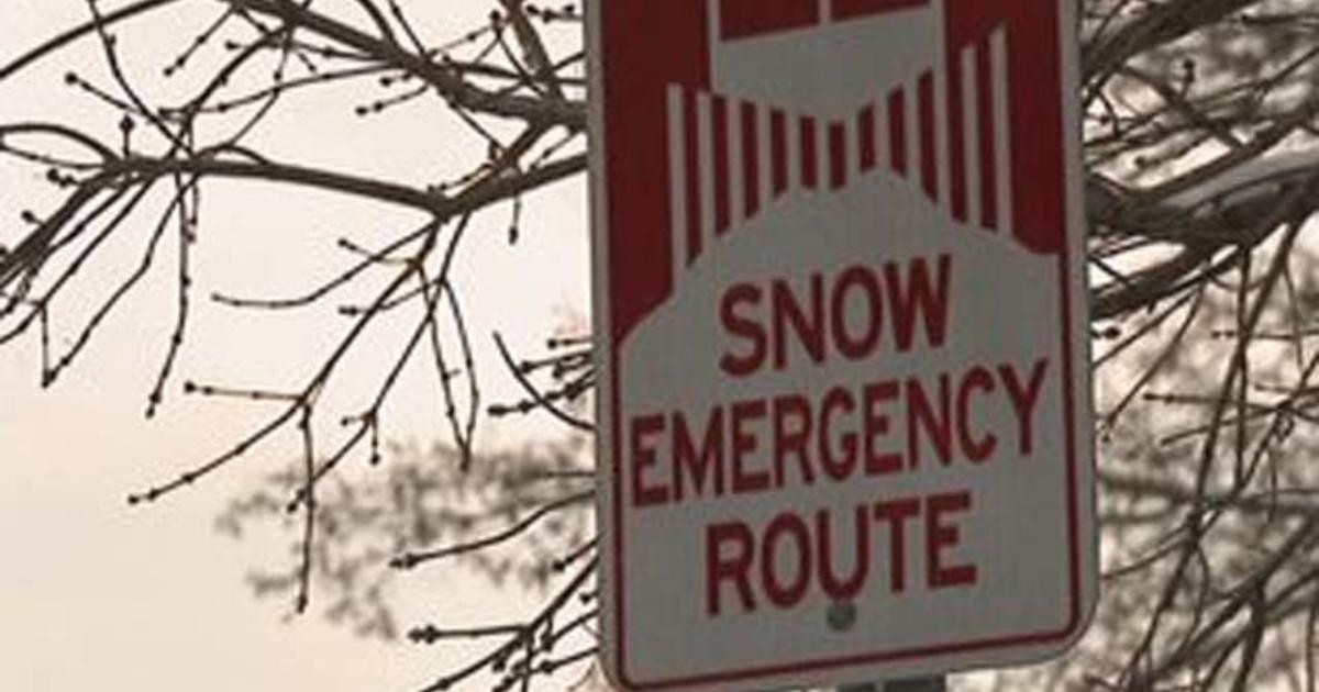 File:Snow falls on a COVID-19 Stay Safe sign in St Paul, Minnesota