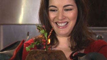 Nigella Lawson prepares a flaming Christmas Pudding. 